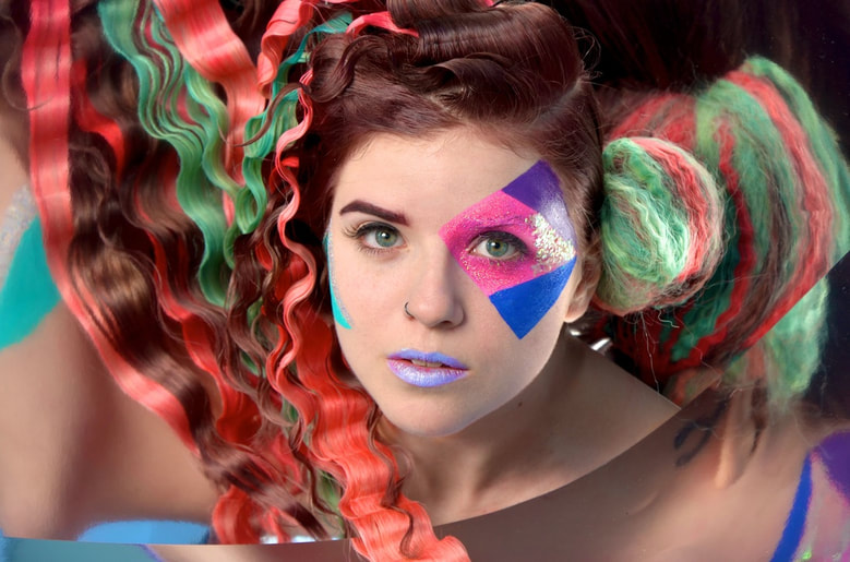 Florian Borgeat - Photography - color portrait of a young woman with colorful hair and fancy fashion hairstyle